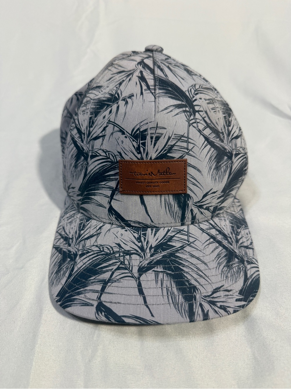 Travis Mathew Palm-Print Grey and Black Baseball Hat with Brown Leather Patch